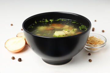 Concept of tasty food with chicken soup on white background