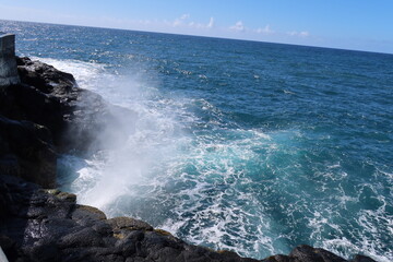 waves breaking on rocks