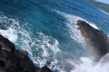 waves breaking on rocks