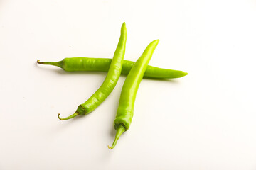 Fresh green chilli on white background.
