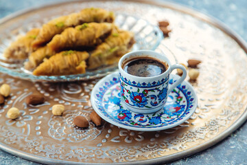 Turkish baklava and coffee on the table. Selective focus.
