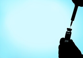 COVID-19 variant a medical syringe and a vial on a background