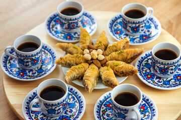 Turkish baklava and coffee on the table. Selective focus.