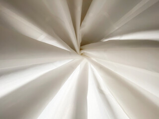 Background of white folded shower curtain