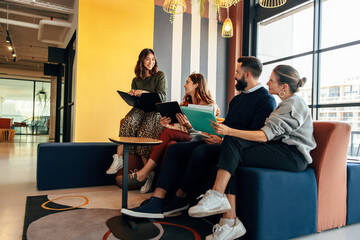 Group of businesspeople working in an office lobby