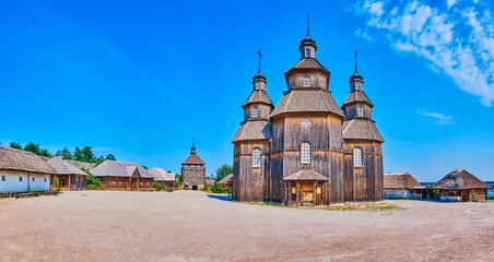 Intercession Cossack Church amid the houses and administrative buildings of Zaporozhian Sich scansen, Khortytsia Island, Zaporizhzhia, Ukraine