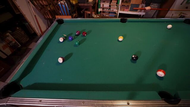 Nailing the cue ball but missing the shot on an old weather green felt table.