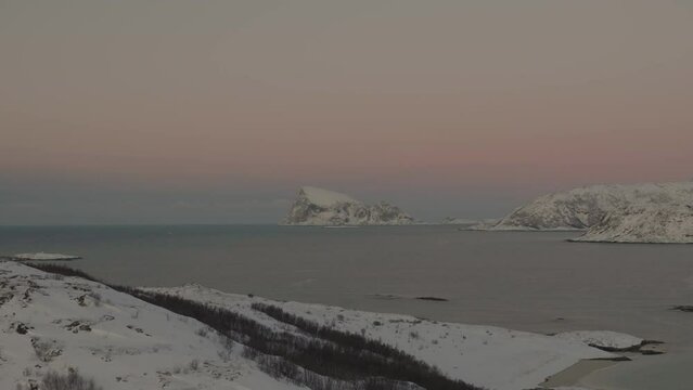Beautiful nature landscape in Norway. Sunrise over snowy mountains