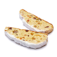 Slices of Traditional Christmas stollen cake with marzipan and dried fruit isolated on white background