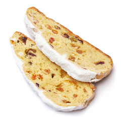 Slices of Traditional Christmas stollen cake with marzipan and dried fruit isolated on white background