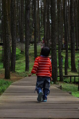 child running in the woods