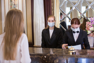 the staff of an elite hotel serves guests
