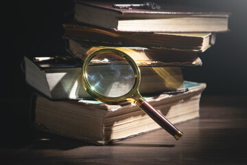 Magnifying glass and book. Education