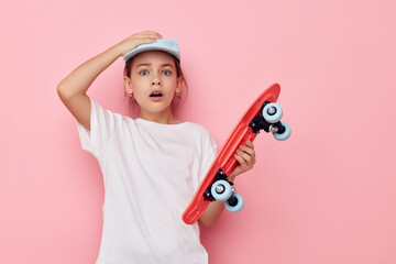 cute girl cap in white t-shirt skateboard Lifestyle unaltered