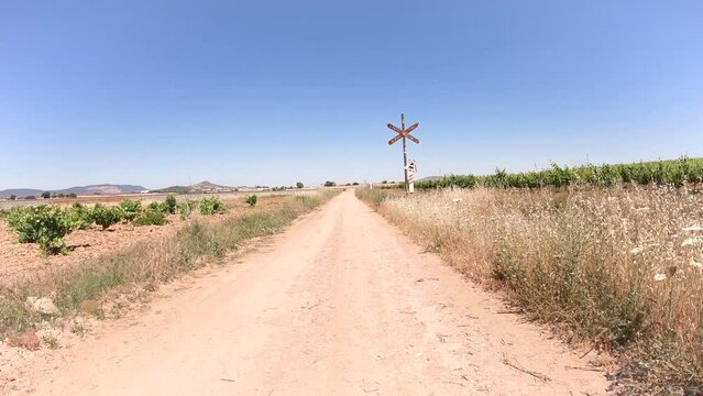 Via de la Plata, dirt road through agricultural plowed fields before arriving to Puebla de Sancho Perez, province of Badajoz, Extremadura, Spain - dolly forward
