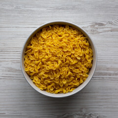 Healthy Dry Farfalline Pasta in a Bowl, top view. Flat lay, overhead, from above.