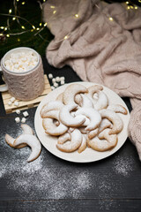 Plate of Traditional German or Austrian Vanillekipferl vanilla kipferl cookies and decorations