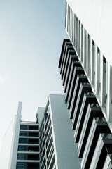 Blue monochrome image of modern multistory residential buildings