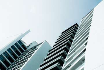 Blue monochrome image of modern multistory residential buildings