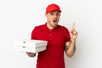 pizza delivery man with work uniform picking up pizza boxes over isolated  white wall intending to realizes the solution while lifting a finger up