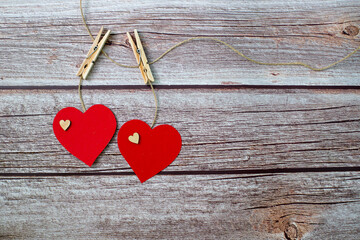 Two red hearts on wooden background. Mockup. Copy space. Valentine's day. Space for text. 