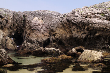 Naklejka na ściany i meble Coastal part of Cantabria in the north of Spain, Costa Quebrada, ie the Broken Coast, around Playa de Somocuevas cove beach in Liencres 