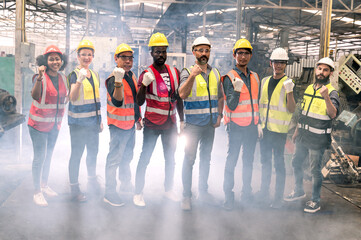 Engineering team with technician and worker operating. Group photo in factory, teamwork concept.