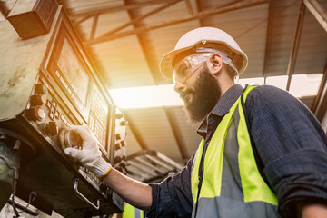 Industrial factory concept. Engineering with technician and worker operating and maintenance of machinery.