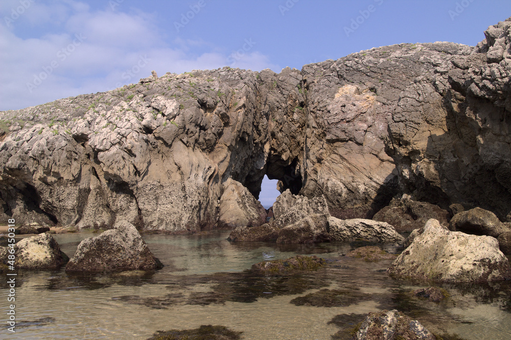 Wall mural Coastal part of Cantabria in the north of Spain, Costa Quebrada, ie the Broken Coast, 
around Playa de Somocuevas cove beach in Liencres
