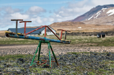 rusty seesaw in no man's land