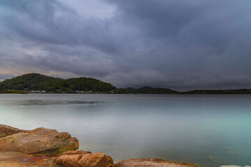 Rainy day sunrise by the bay