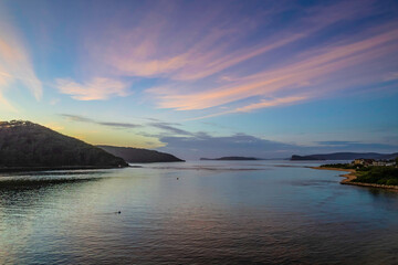 Aerial sunrise waterscape with boats