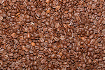 Texture of coffee beans. Coffee beans on the table background