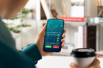 Businessmen work with stock market investments using smartphones to analyze trading data. smartphone with stock exchange graph on screen. Financial stock market.
