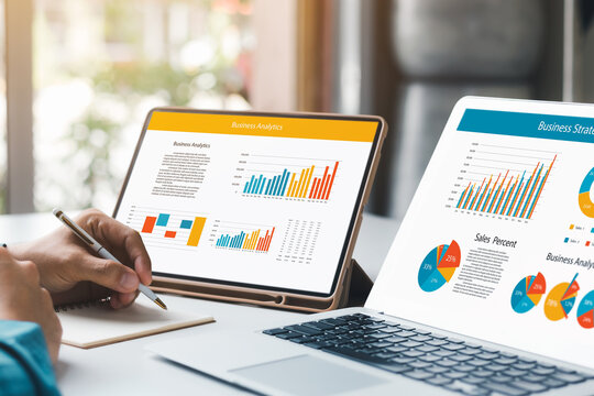 Businessman analyzing company's financial balance sheet working with digital augmented reality graphics. Businessman calculates financial data for long-term investment.
