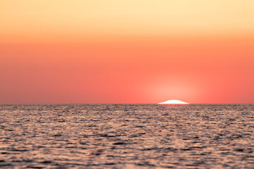 sun rising at dawn over the mediterranean sea on the costa brava