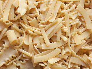 mixed pasta of various shapes background
