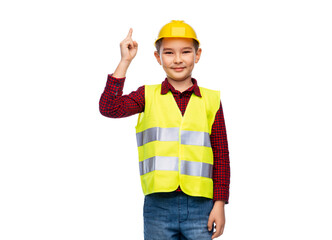 building, construction and profession concept - little boy in protective helmet and safety vest pointing finger up over white background