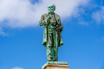 Fototapeta na wymiar Outdoor bronze statue, monument of Luigi Orlando in Livorno, Tuscany, Italy