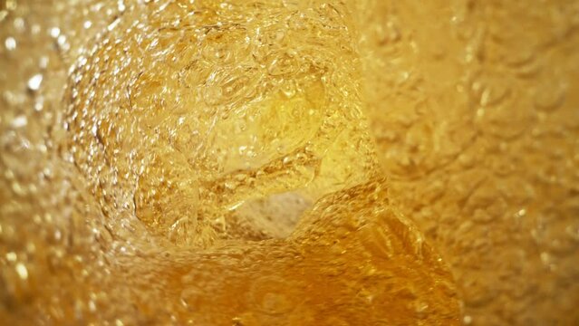 Super slow motion of pouring beer in twister shape. Filmed on high speed cinema camera 1000 fps. Ultimate inside bottle view filmed with special wide angle macro lens.