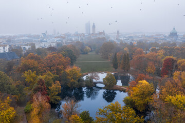 Autumn park - Leipzig Germany Johannapark - flying birds, foggy mist weather