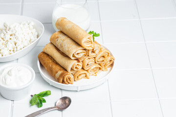 Pancakes with cottage cheese on a white background.