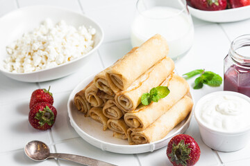 Pancakes with cottage cheese on a white background.