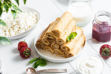 Pancakes with cottage cheese on a white background.