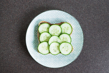 fresh cucumber sliced up on toast, simple ingredients concept