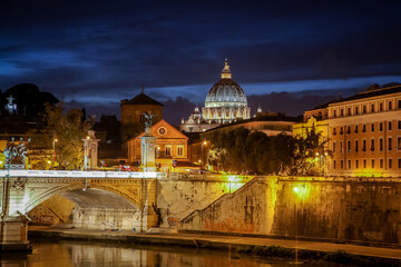 Fototapeta na wymiar View of the Victor Emmanuel bridge and St. Peter's Cathedral in the evening. Rome, Lazio, Italy