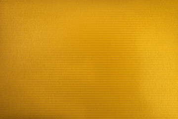 Naklejka premium Golden color cardboard texture. Golden color glitter with light