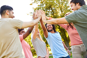 Multicultural group of young people high five