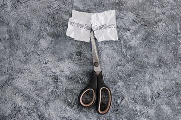 Manipulation text on crumpled piece of paper which is getting cut with scissors, psychology and...