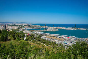Panoramic view over Passeig de Colom, La Barceloneta, Port Vell marina, Christopher Columbus monument in Barcelona city, Catalonia, Spain
